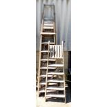 A group of wooden step ladders.