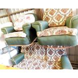 A vintage three seater sofa and two matching armchairs, in floral upholstery.