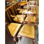 A set of six George III style dining chairs, each with mahogany ball and claw feet and drop in seats