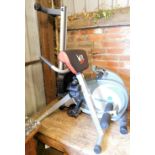 A group of gym equipment, to include a Roger Black rowing machine and weight support. (2)