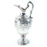 A Victorian silver chess related claret jug trophy, cast with a band of chess pieces, scrolls, etc.,