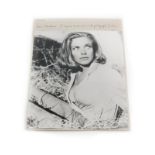 Honor Blackman. A signed black and white photograph of the actress in the stables at Goldfinger's