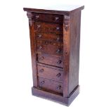A Victorian oak Wellington chest, with seven drawers, each with turned wood handles, on a plinth,