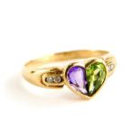 A 9ct gold dress ring, the central heart shape set with amethyst and peridot, with tiny diamond
