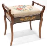 An Edwardian mahogany and marquetry piano stool, on splayed legs.