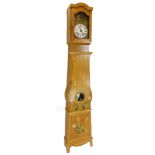 A 19thC French provincial comptoise longcase clock, with enamel dial, and outer embossed brass case,