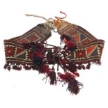 A Persian tent hanging or horse harness, with geometric carpet woven section or applied with