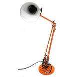 A vintage orange painted Anglepoise type lamp, 92cm high.