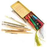 A set of four Burnham's bridge propelling pencils, and various gold plated and other propelling