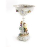 A German porcelain centrepiece, the pierced top flower encrusted and painted and with flowers, on