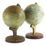 A pair of early 20thC William Crawford and Sons (biscuit maker's) tin plate table globes, printed