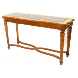 A French hardwood serving table or side table, the shaped top with three smoked glass inserts,