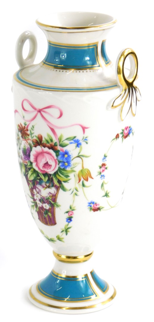 A Minton porcelain two handled vase, printed with flowers, title to underside Minton Rose vase