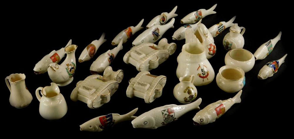 A quantity of crested ceramics, to include three First World War tanks, various fish, etc.