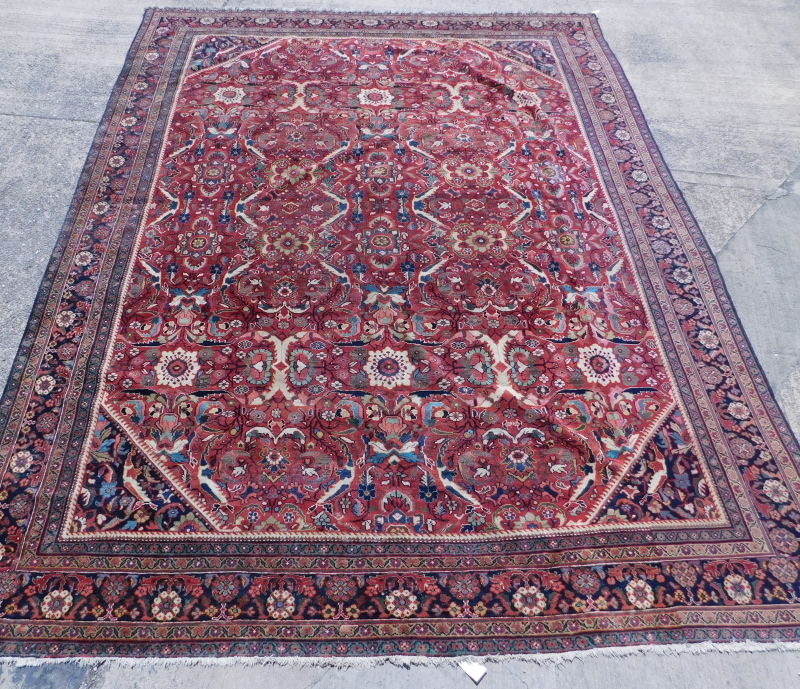 An Indian Mahal carpet, with an all over Heriz type design, with flower heads, medallions, etc.,