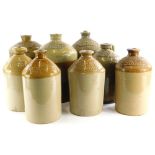 A collection of stoneware flagons, names all relating to Lincolnshire, to include Tadcaster Tower