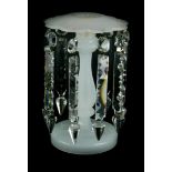 A late 19thC white opaque glass table lustre, with prismatic cut drops, (AF), 23cm high.