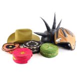 A quantity of dressing up hats, to include a PVC hat with spiked top, an American football type hat,