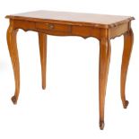 A French walnut side table, the rectangular top with a shaped moulded edge, with a small frieze