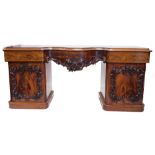 An early Victorian figured mahogany sideboard, the rectangular top with a moulded serpentine central