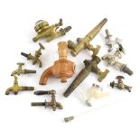 A collection of barrel and other taps, to include a stoneware example stamped Doulton Lambeth,