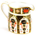 A Royal Crown Derby porcelain milk jug, decorated with the 1128 Imari pattern, 9cm high.