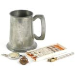 A collection of items, to include a Tank Corp military badge, various crustacean picks, a silver