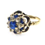 A 9ct gold sapphire and diamond floral cluster ring, the central stone of oval raised design with