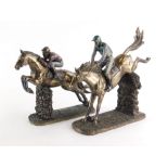 Two similar Veronese resin figures of horses and jockeys jumping fences, the largest 27cm high.