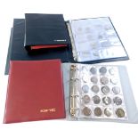 Three albums containing a mixture of coins, and various empty albums.
