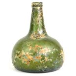 An 18thC green glass onion shaped wine bottle, signs of excavation, 19cm high. Reports are no longer