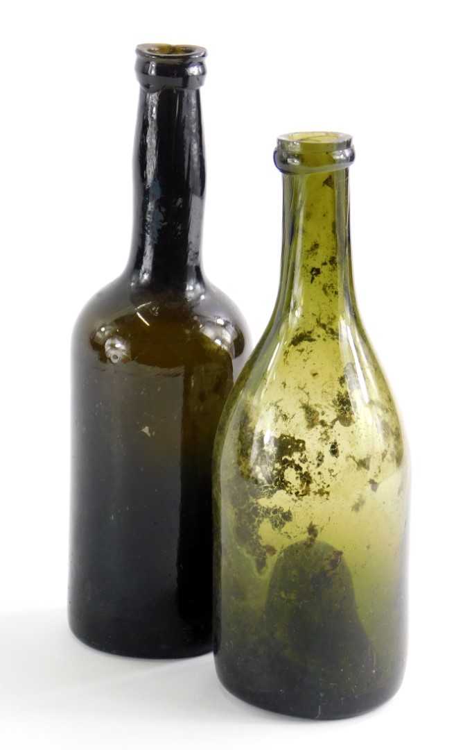 Two 19thC green glass wine bottles, 24cm and 22cm high.