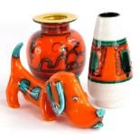 A Tokio Flora Dutch vase, another similar vase and a Dachshund. (3)