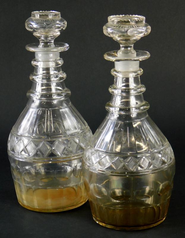 A pair of Georgian ring necked mallet shaped decanters, with cut banding and slice cut decoration,