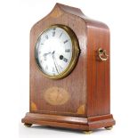An Edwardian mahogany and marquetry mantel clock, with arched case, the white enamel dial