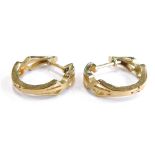 A pair of 9ct gold hoop earrings, each of hinged design with pierced decoration, the ring hoop 2cm