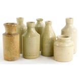 A collection of small stoneware bottles, various stamps to include Doulton Lamberth, H and V