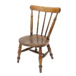 A 19thC country made ash and elm child's chair, on turned legs.