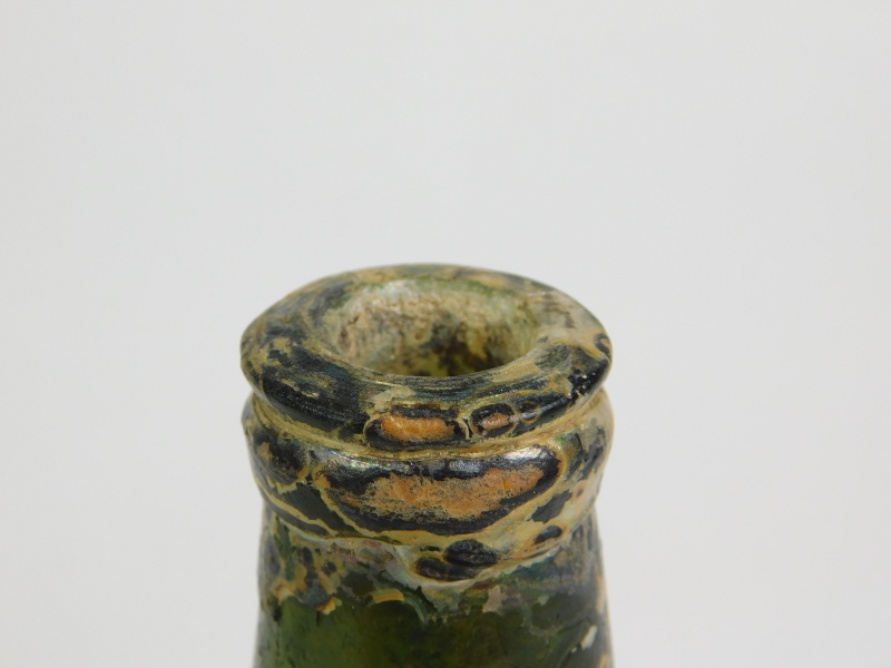 An 18thC green glass onion shaped wine bottle, signs of excavation, 19cm high. Reports are no longer - Image 3 of 4