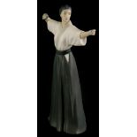 A Lladro matte glazed porcelain figure of a Japanese female archer, impressed marks to underside