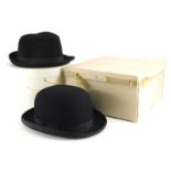 A Dunn and Co bowler hat, and a wool Trilby, both boxed.