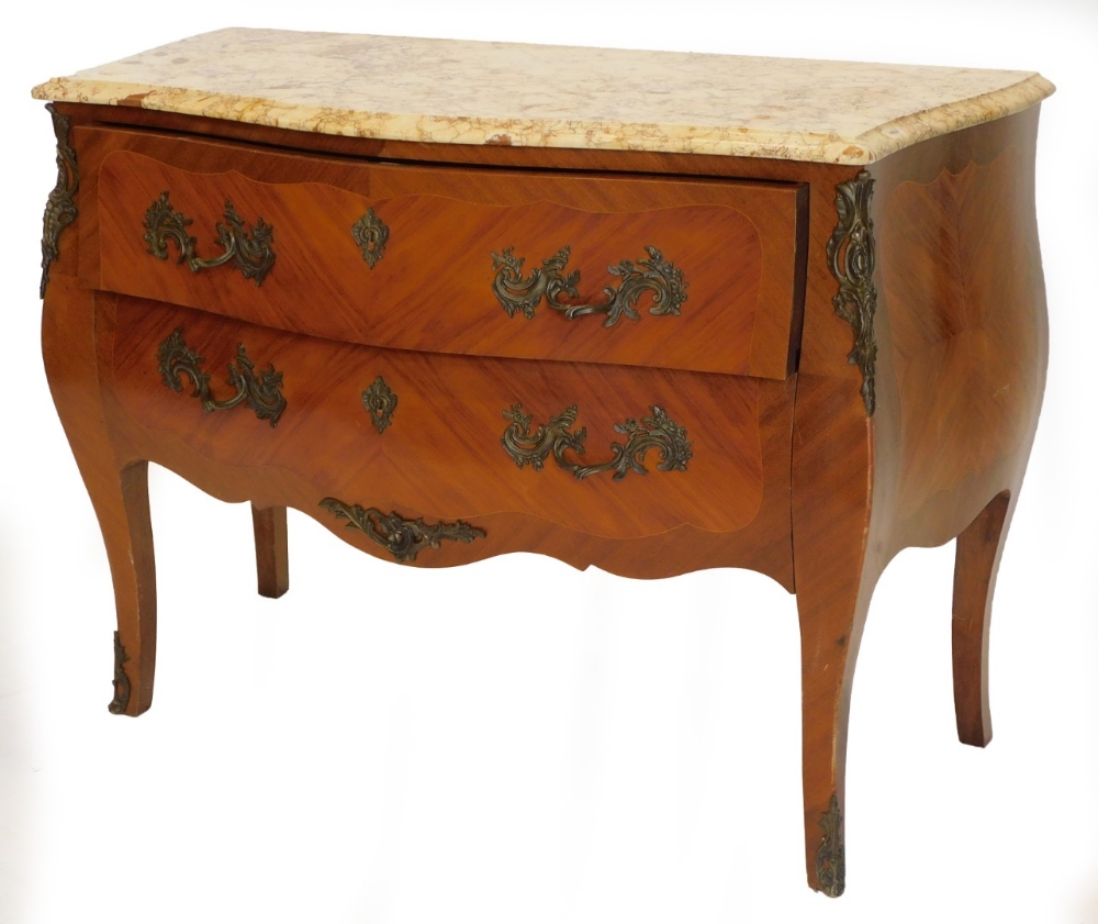 A French mahogany commode, with a serpentine shaped top with a variegated yellow marble, above two