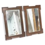 A pair of oak rectangular wall mirrors, each with a bead and reed border, 89cm x 59cm.