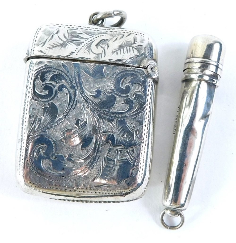 A late Victorian silver Vesta case, engraved with leaves, flowers, etc., Birmingham 1896, and a