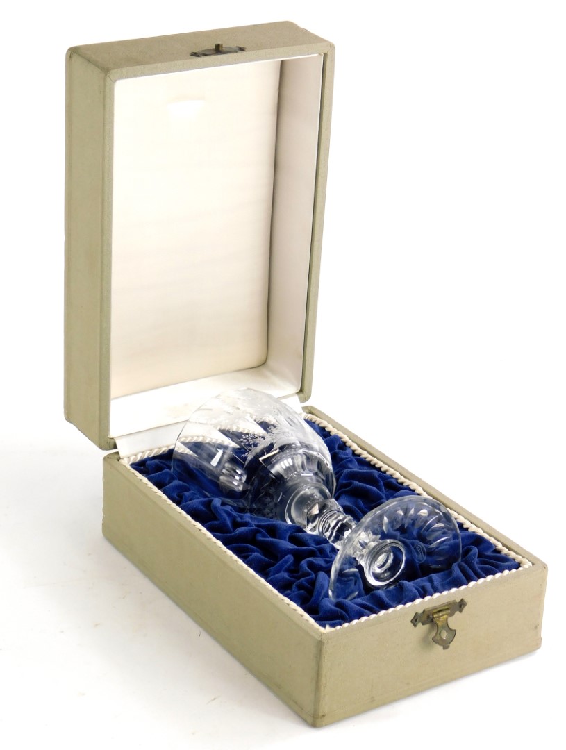 A Moser engraved glass goblet, with a faceted stem in presentation box, the goblet 18cm high.