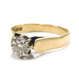 A 9ct gold solitaire ring, set with imitation tiny diamond, in a white gold setting, raised