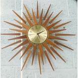 A 1960's/70's Seth Thomas sunburst wall clock, in teak and gilt metal, the dial stamped