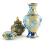 Three items of oriental cloisonne, to include a jar and cover with lion mount to the lid, 13cm high,