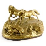 A late 19th/early 20thC bronze figure group, of wolves attacking a young foal and horses on a