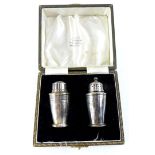 A George VI Art Deco silver cruet, of tapering cylindrical form, Birmingham 1949, in fitted case.